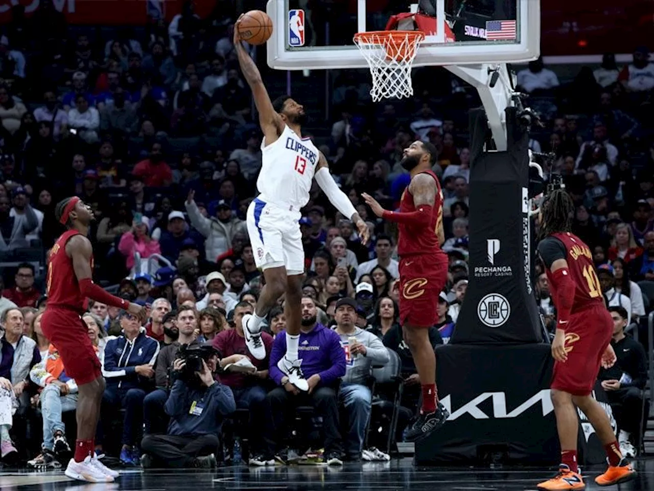 George late show sparks Clippers over Cleveland