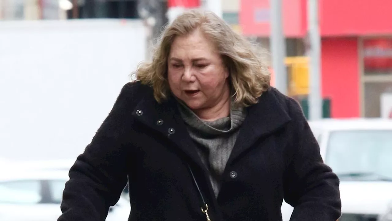 Hollywood icon Kathleen Turner looks unrecognizable as she struggles with a cane during a rare...