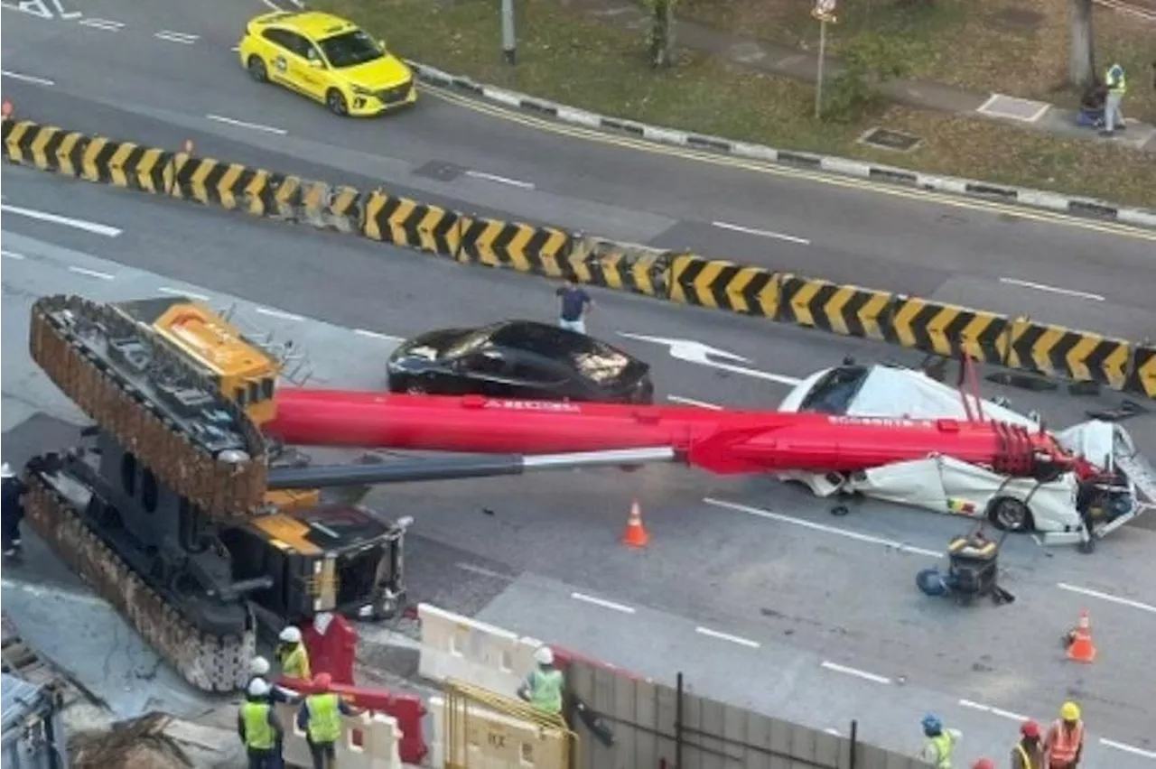 Miraculous escape: Driver jumps out seconds before crane topples over and crushes van in Sengkang