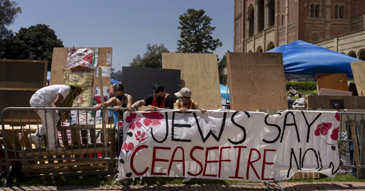 UCLA cancels classes after overnight clashes between dueling protesters