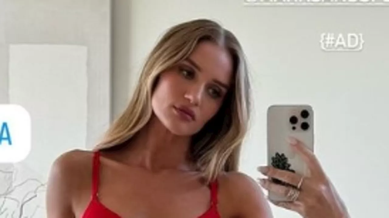 Rosie Huntington-Whiteley shows off her toned figure in red lingerie