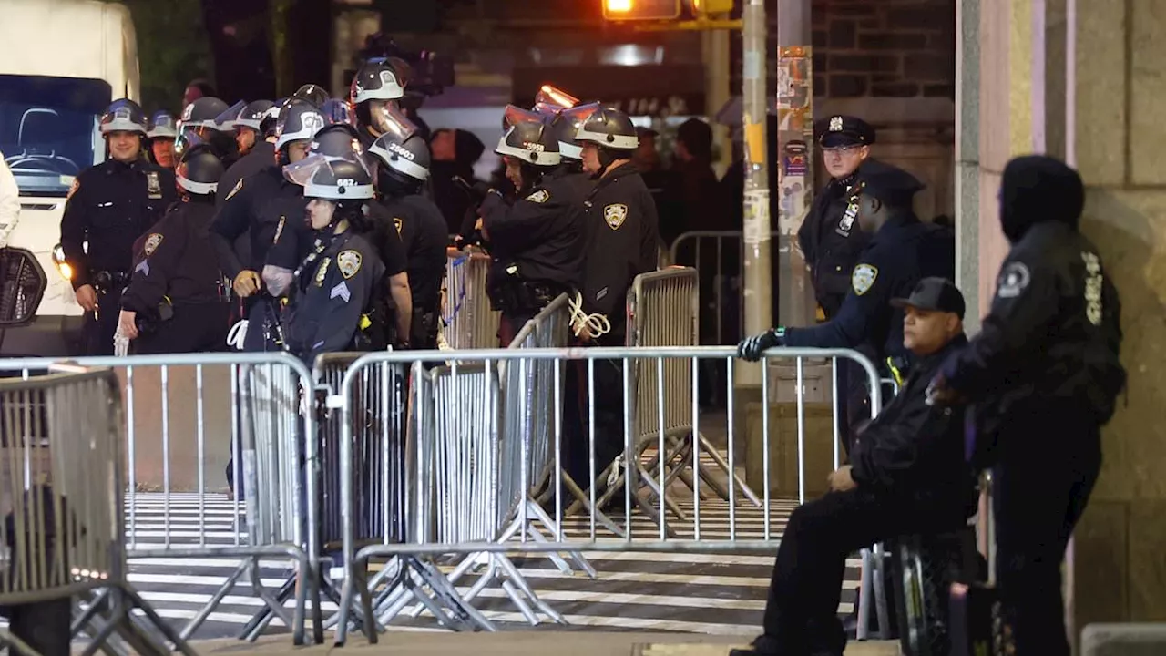 NYPD officers dressed in riot gear swarm Columbia University