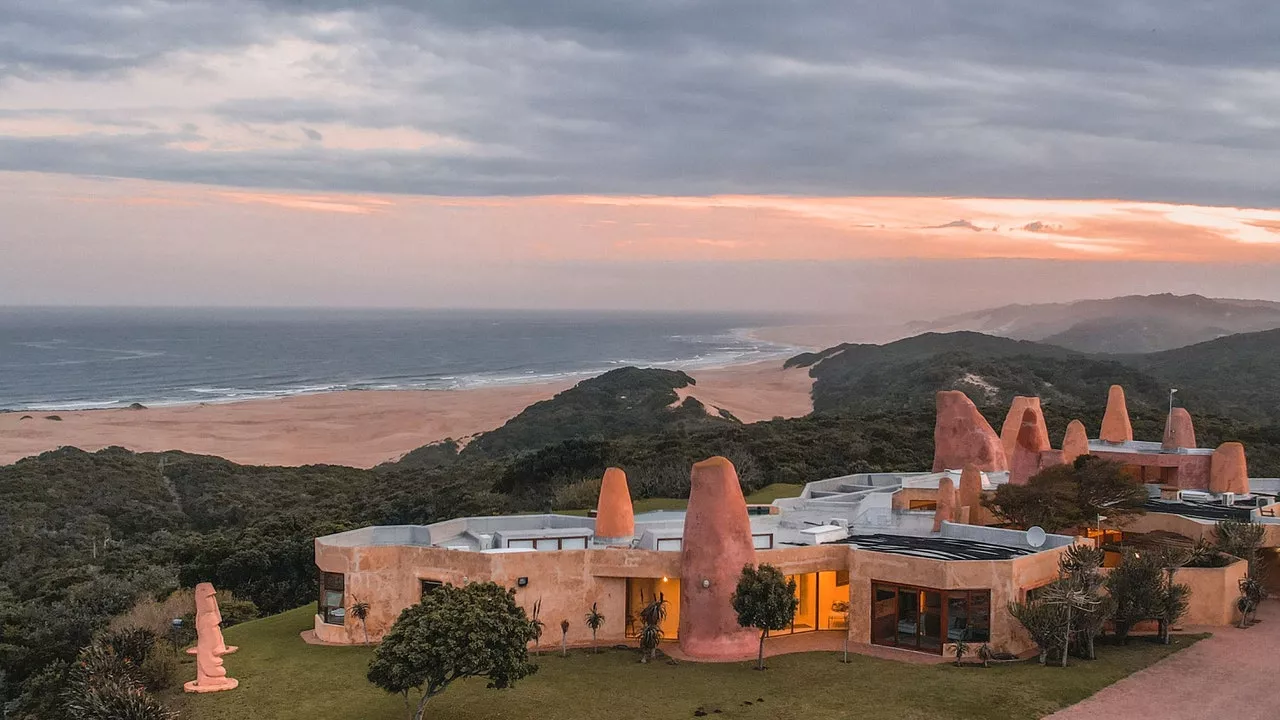 I stayed in a remote pink villa in South Africa with wild giraffes roaming the garden