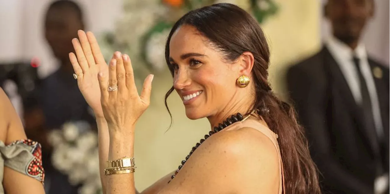 Duchess Meghan Wore a Backless Gown Called the “Windsor” on Her First Day in Nigeria