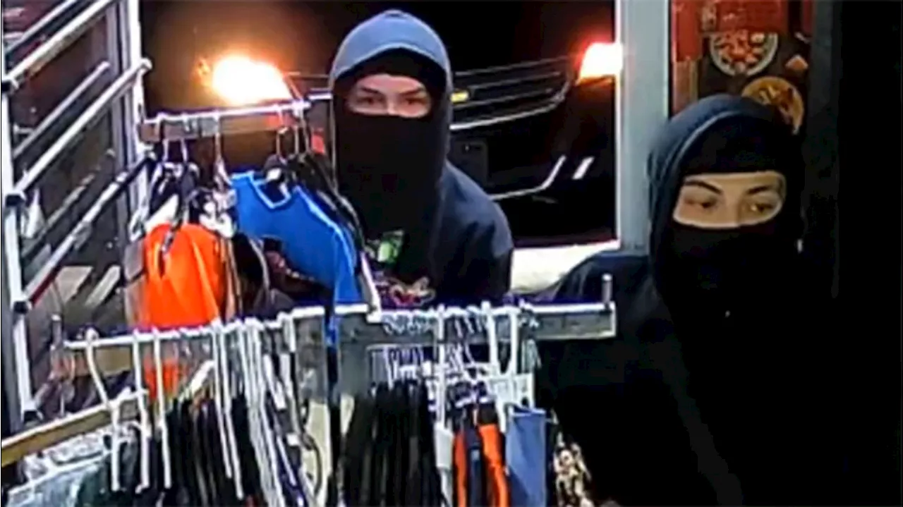 Two masked men -- one with assault rifle -- seen on video robbing N. Harris County store