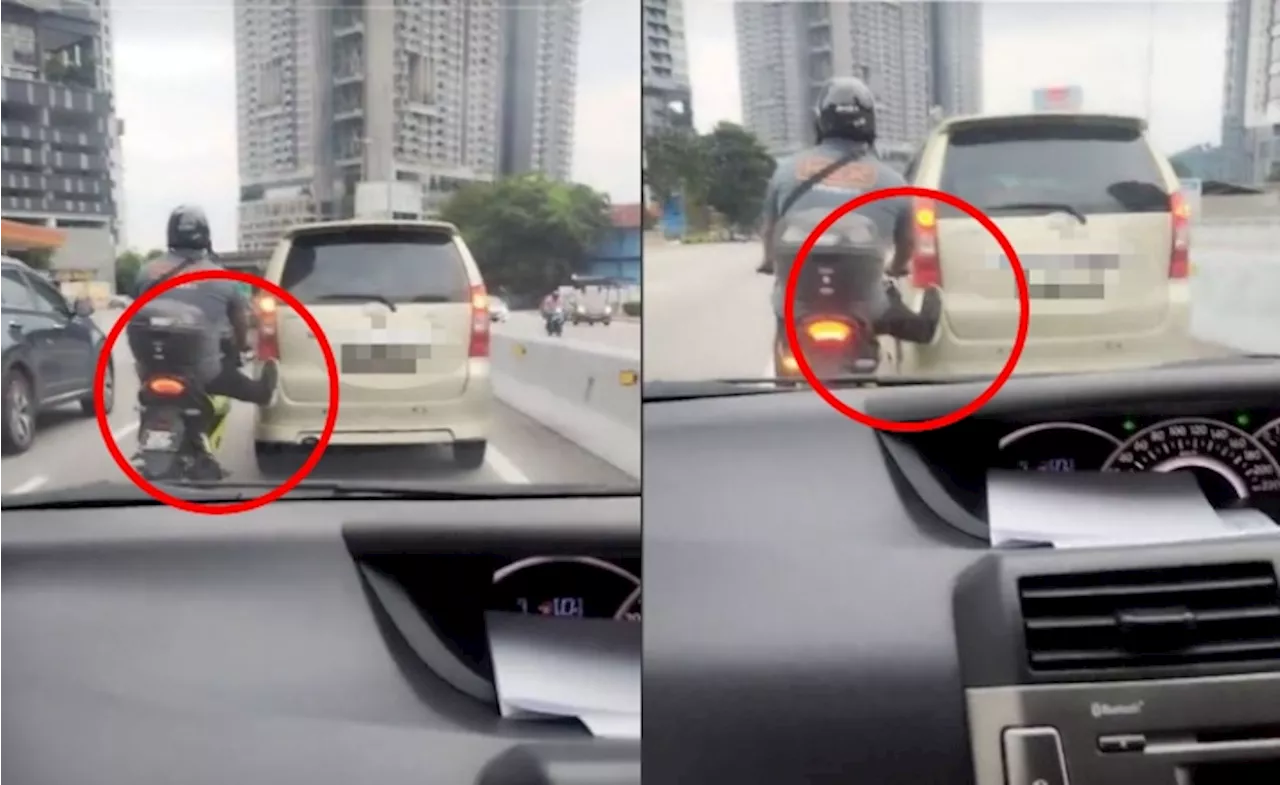 [Video] Aksi Penunggang Motosikal Tunda Kereta Avanza Guna Sebelah Kaki Di Jalan Raya Raih Perhatian