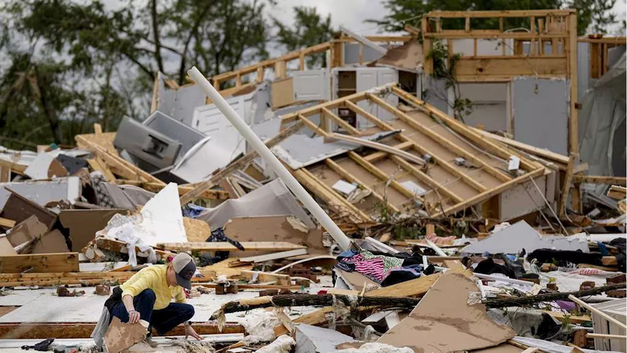 Storm-battered South is again under threat; boy swept into a drain fights for his life