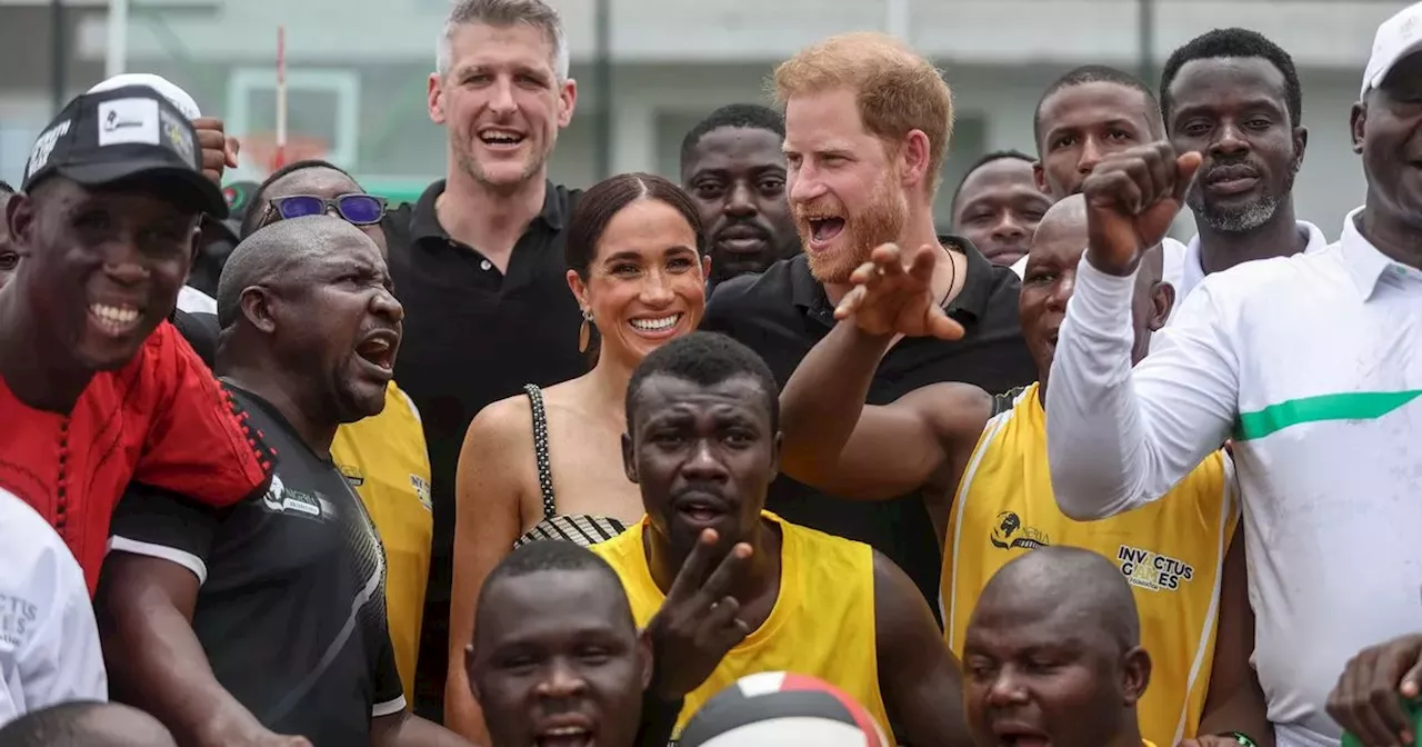 Meghan Markle and Prince Harry beam as they hold hands on second day of tour