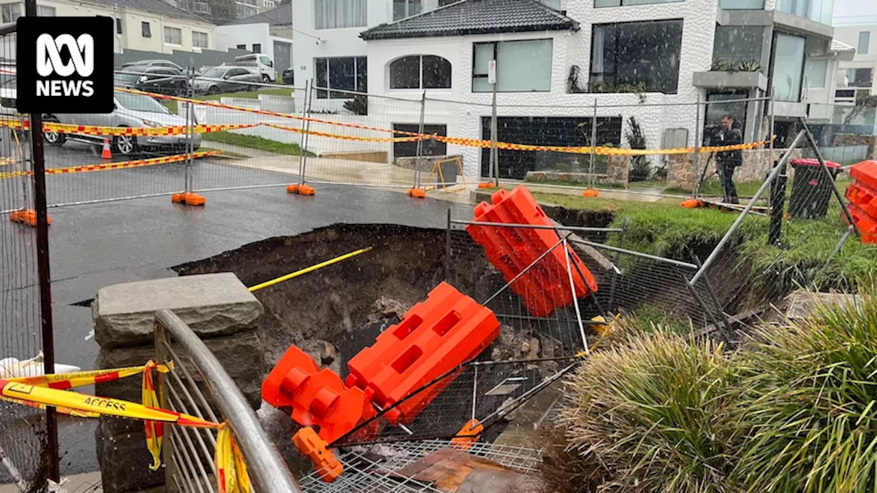 Locals in Sydney's east blast council after 10-metre sinkhole opens where landslip happened last year