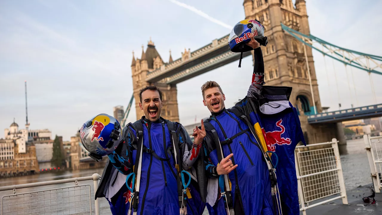 Breathtaking moment Red Bull skydivers fly through Tower Bridge at 152mph in extraordinary world first...