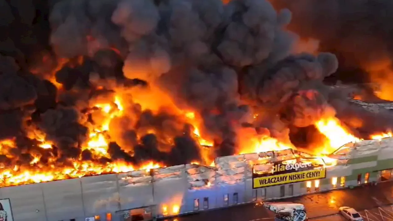 Horror moment huge inferno tears through shopping mall in Warsaw & destroys complex as firefighters tackle...