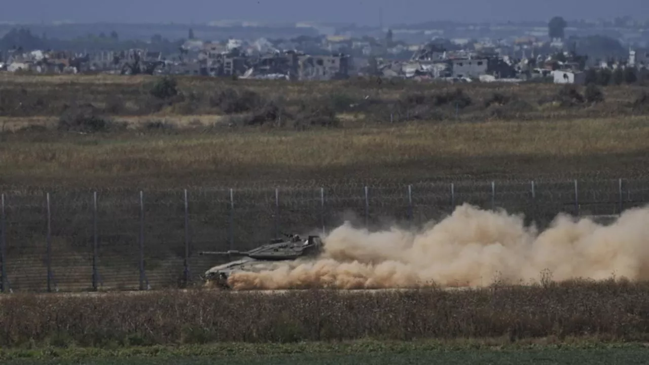 Israeli forces push into Gaza from north and south