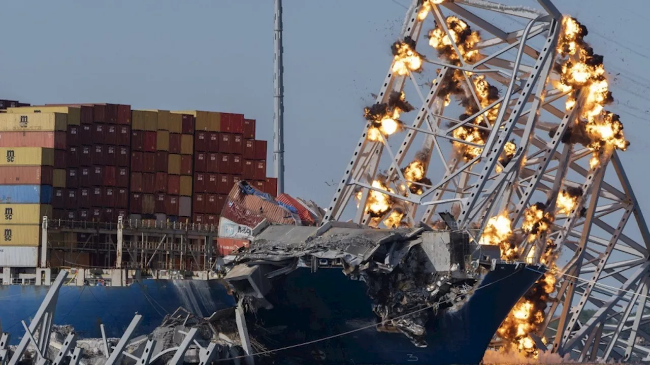 Collapsed Baltimore bridge span comes down with a boom after crews set off chain of explosives