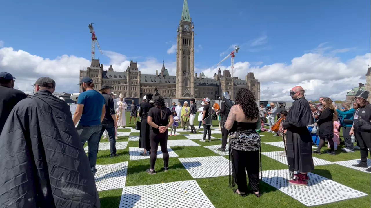 Human chess game turns Parliament Hill black and white for Alzheimer's research