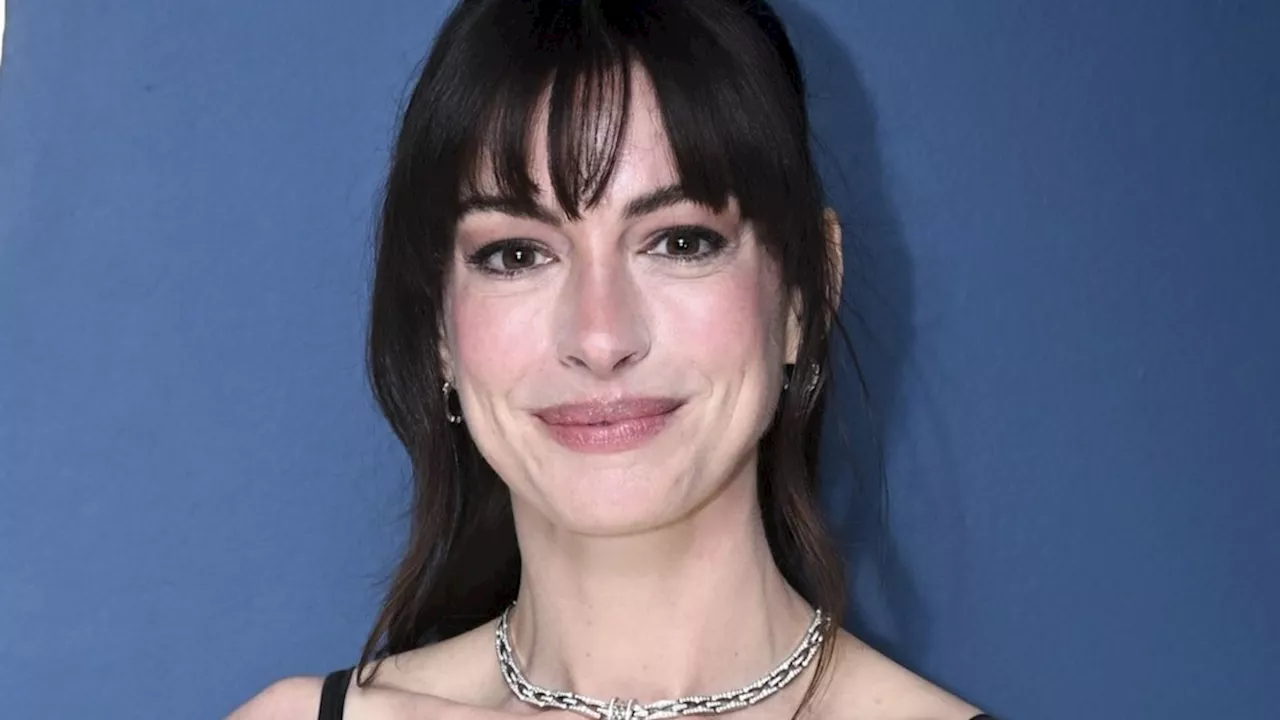 Anne Hathaway is almost unrecognizable with blonde hair and a sheer gown in throwback snap