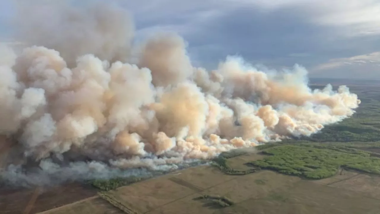 Massive wildfire torches 86,486 acres in Canada, 100s flee, rescue on