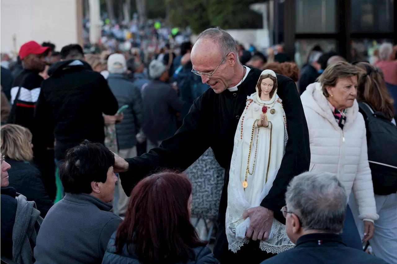 Faithful descend on Portugal’s Fatima to pray for peace as wars rage