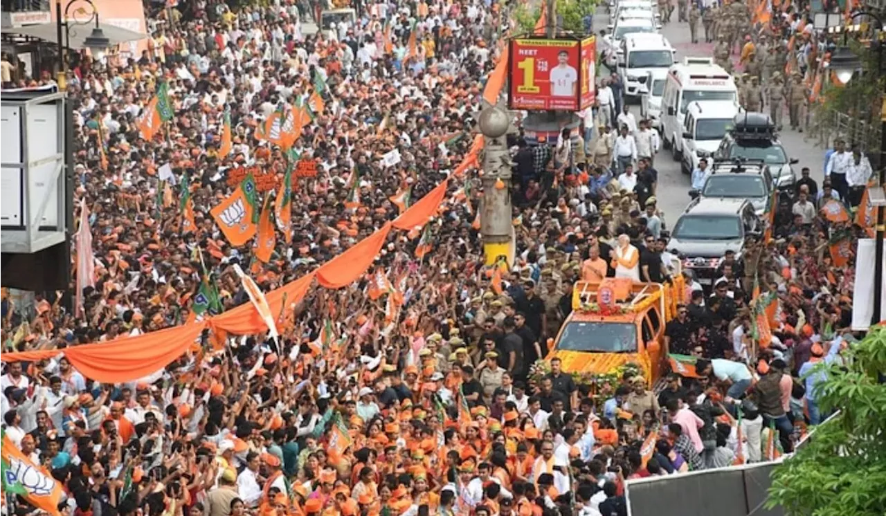 PM Modi Varanasi Roadshow: भगवा रंग में डूबी काशी, पीएम की झलक पाने को बेताब दिखे लोग, देखें तस्वीरें