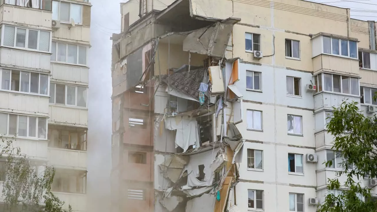 Rescuers search rubble after apparent airstrike on residential building in Ukraine