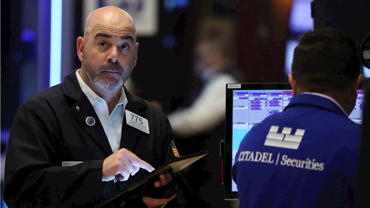 Dow ends win streak, meme stocks surge in Monday rally