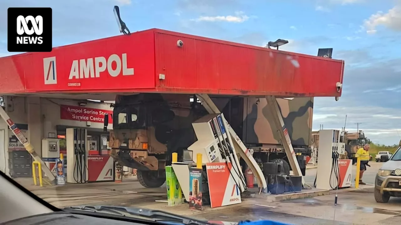 Army truck crashes into petrol station on Bruce Highway at Sarina on way to Defence exercise