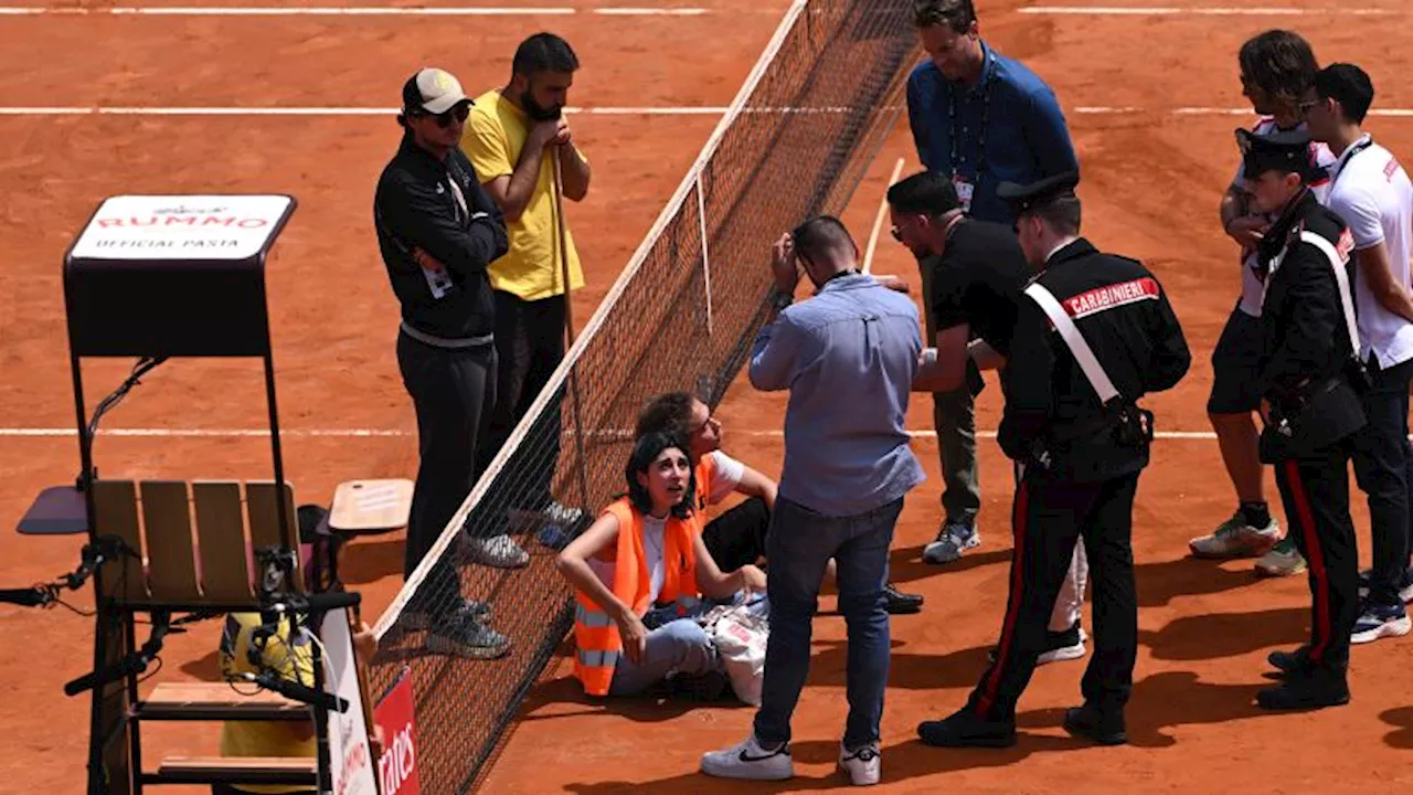 Climate protesters interrupt Italian Open matches, throwing confetti on the court and gluing themselves to stands