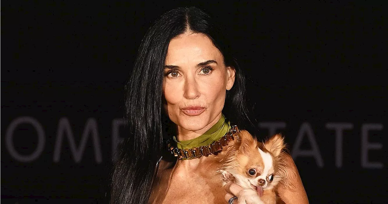 Demi Moore Wears Lace Dress and Carries Dog Pilaf at Gucci Show