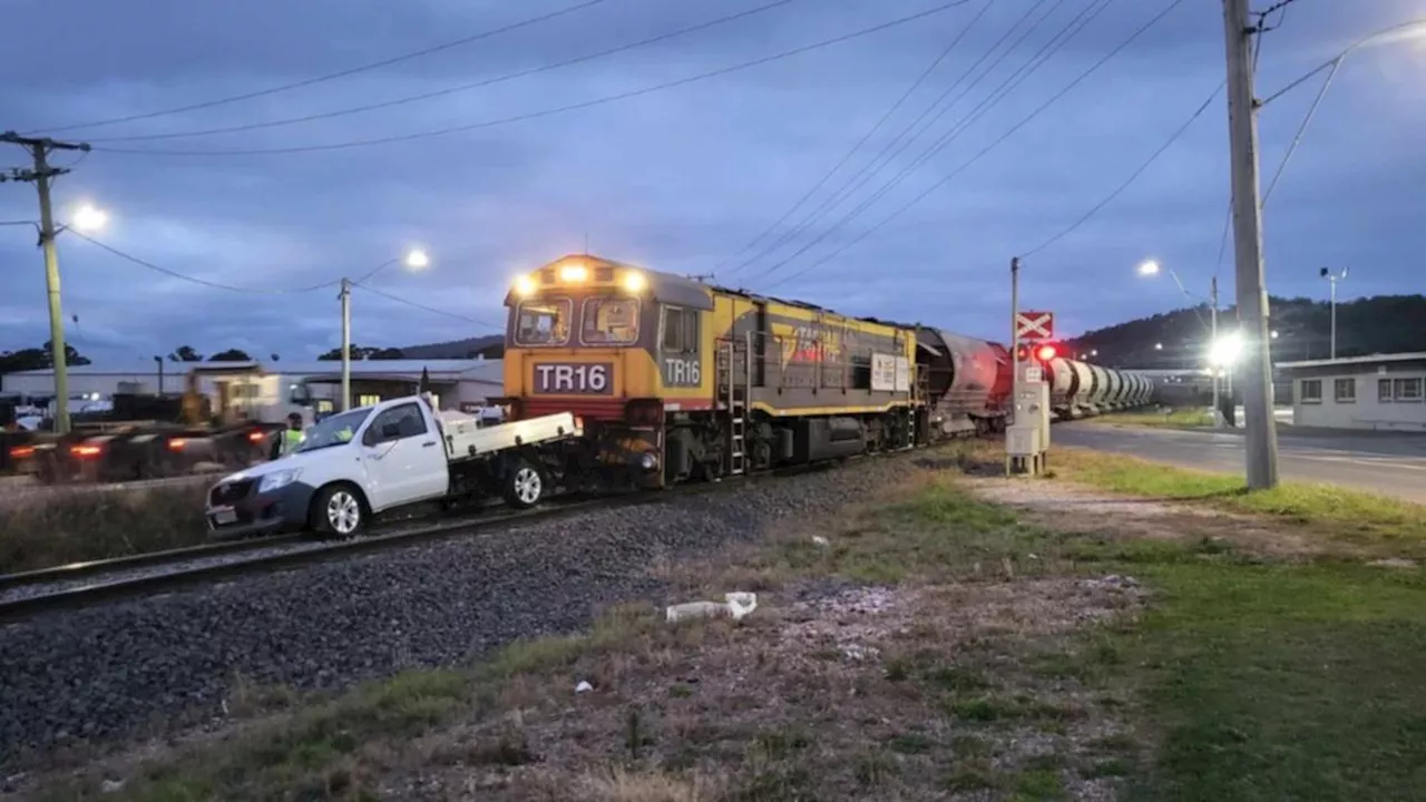 Man jumps free as train crashes into ute stuck on railway tracks in Devonport, Tasmania