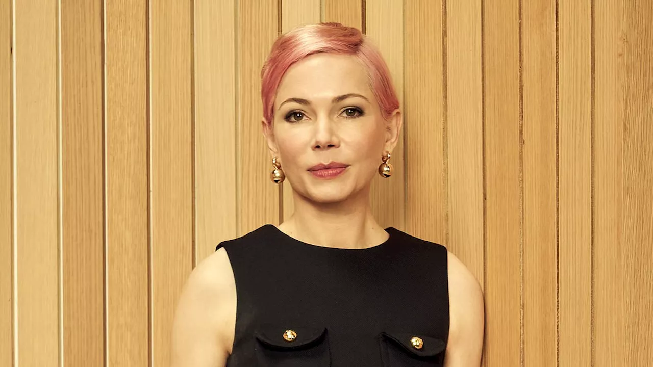 Michelle Williams goes '60s chic in a sleeveless black dress while showing off her pink pixie cut at...