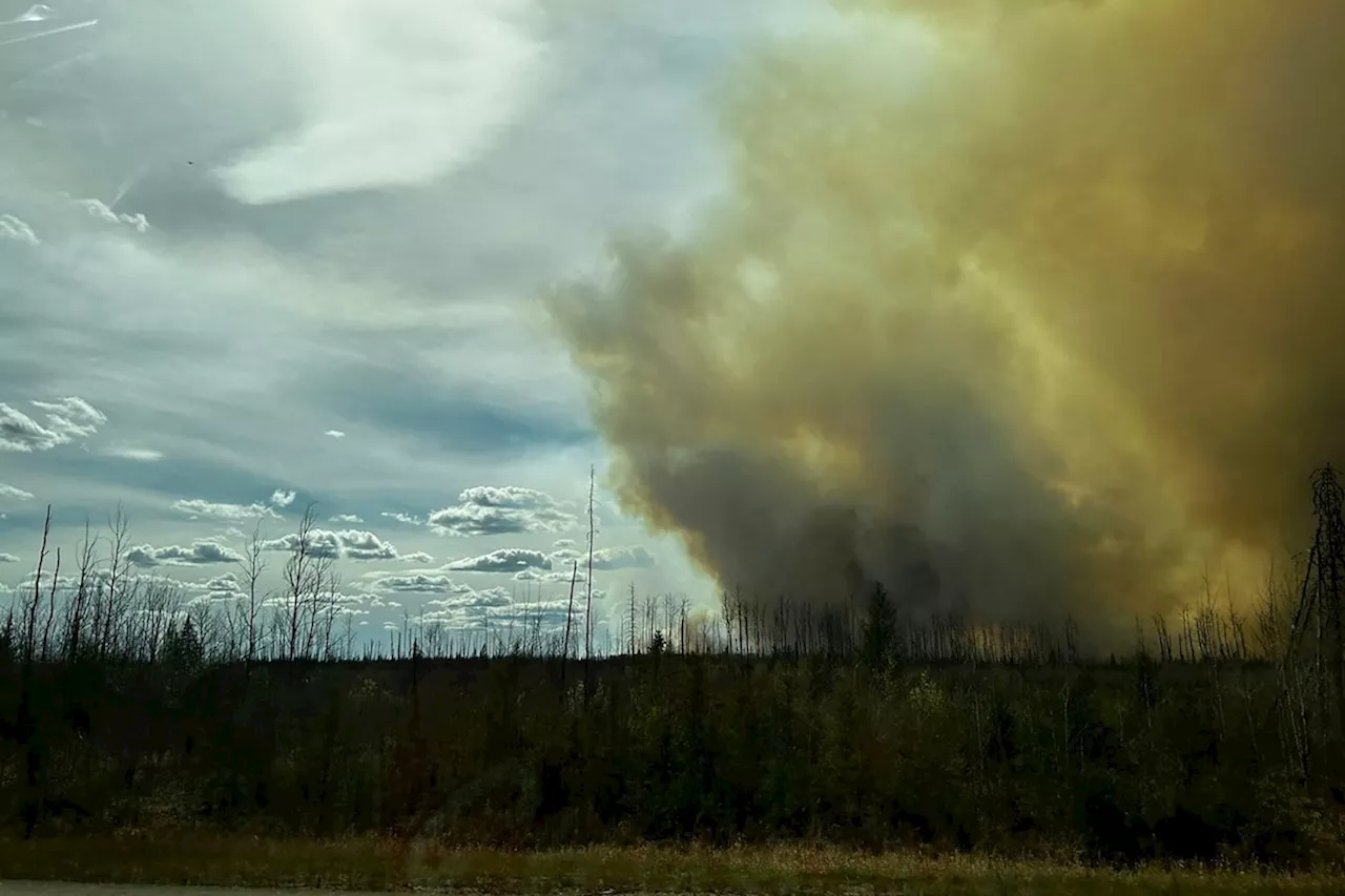 Thousands forced from their homes as wildfires spread across Western Canada