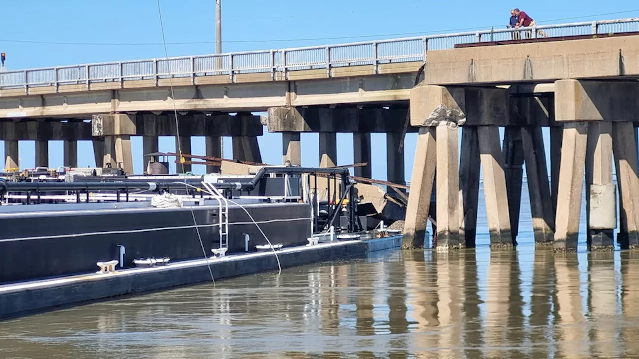 Barge strikes bridge in Galveston, causing closure and oil spill