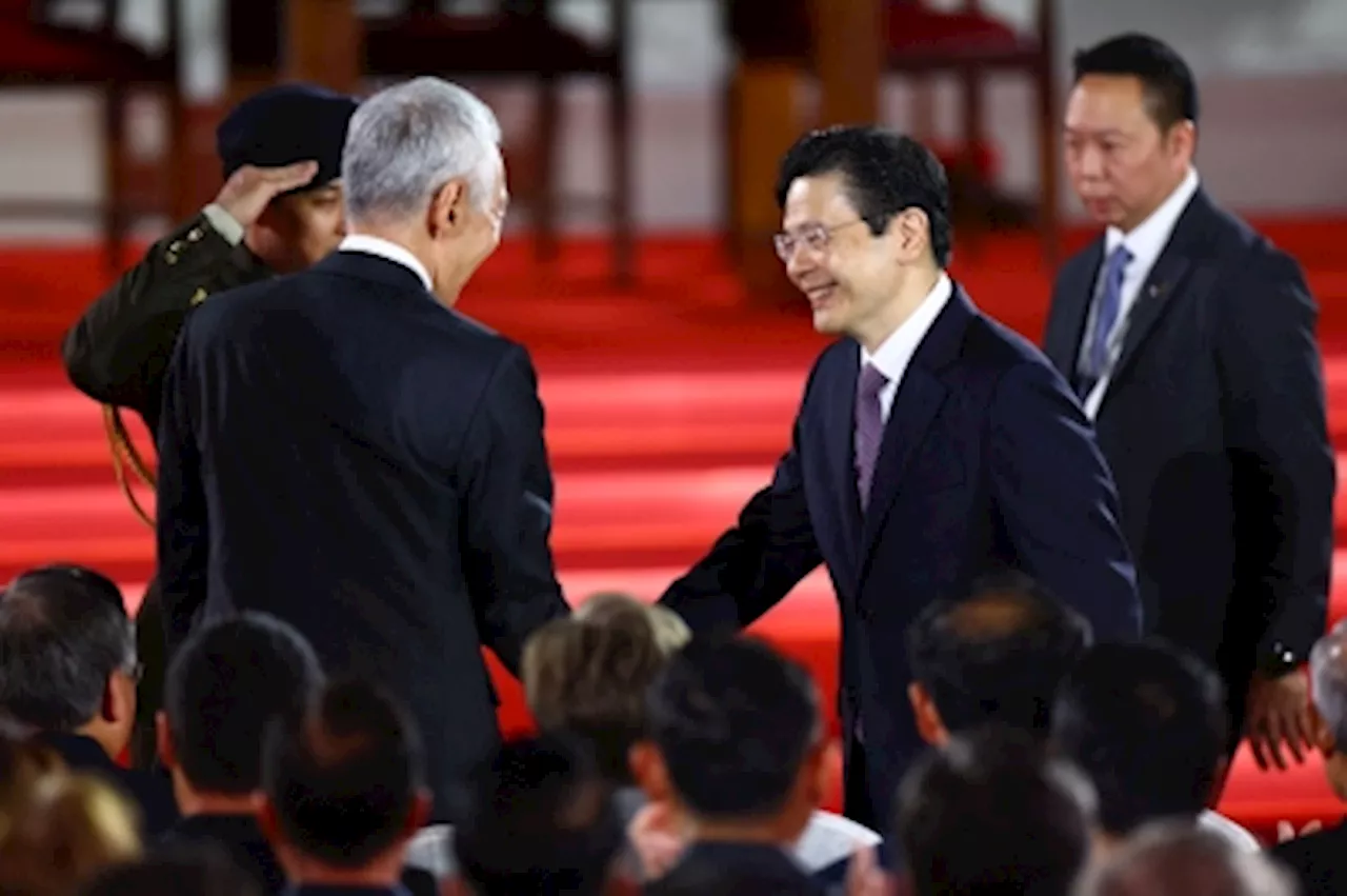 UPDATE 2-Singapore swears in its first new PM in 2 decades