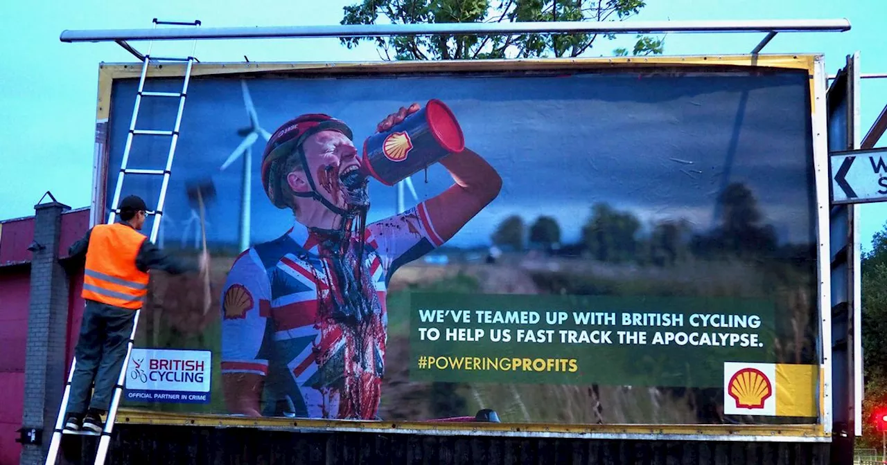 Activists 'hack' billboards across Manchester in protest against oil giant Shell