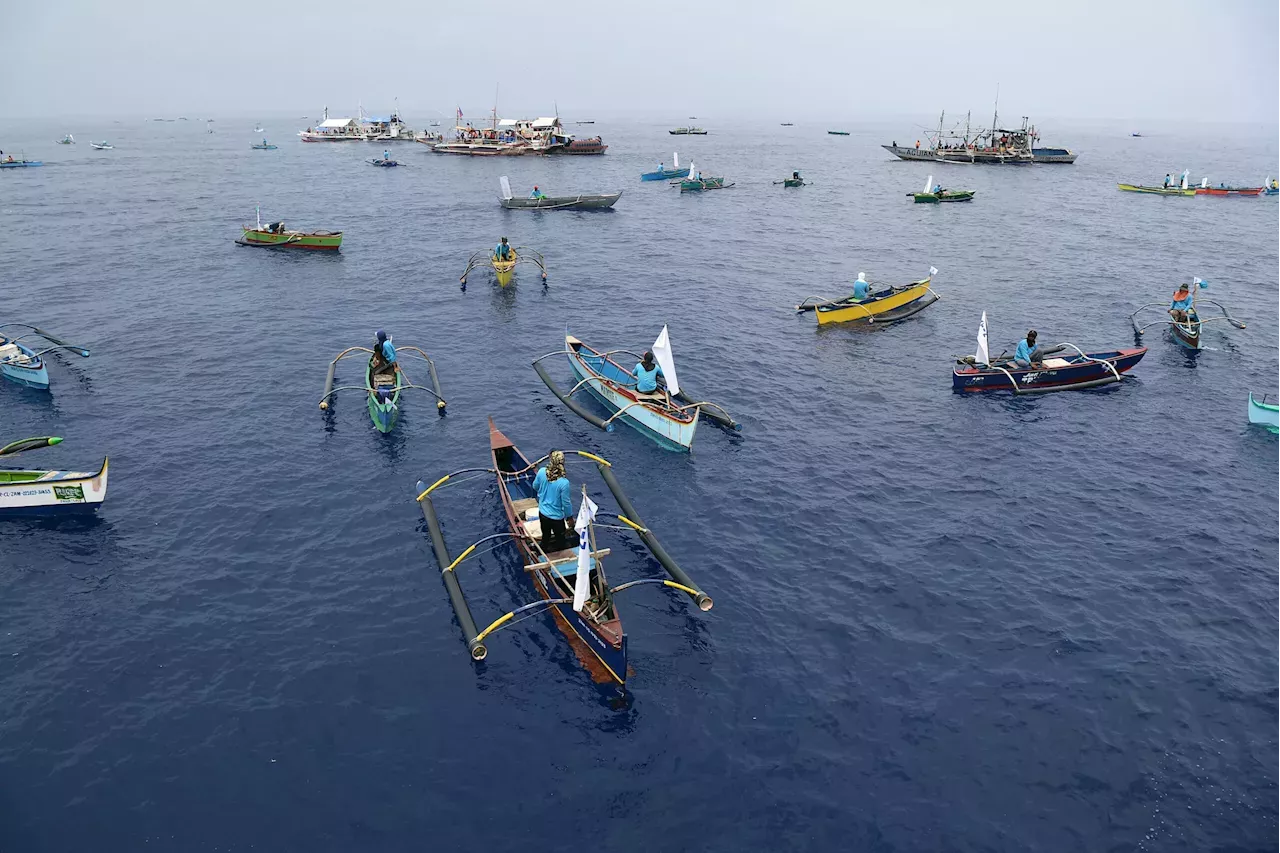 China Coast Guard shadows Philippine boats heading for disputed shoal ...