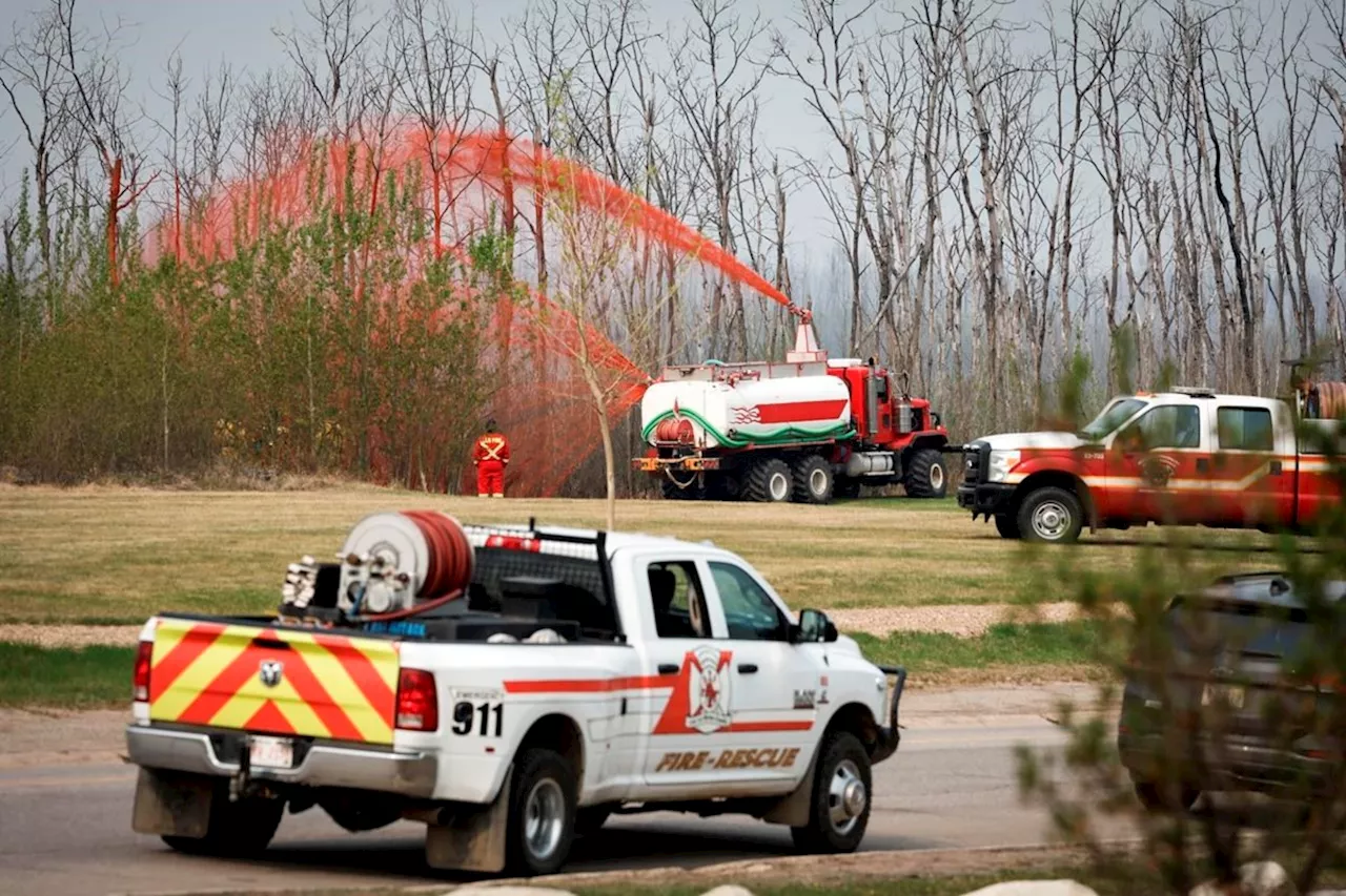 'Day by day': Alberta fire evacuees out until next week, weather to help B.C. crews