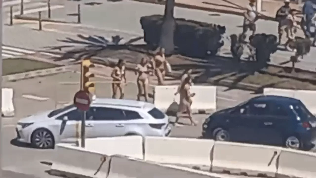 Moment Near NAKED Tourists In Bikinis Are Confronted By Furious Majorca Locals After Spilling