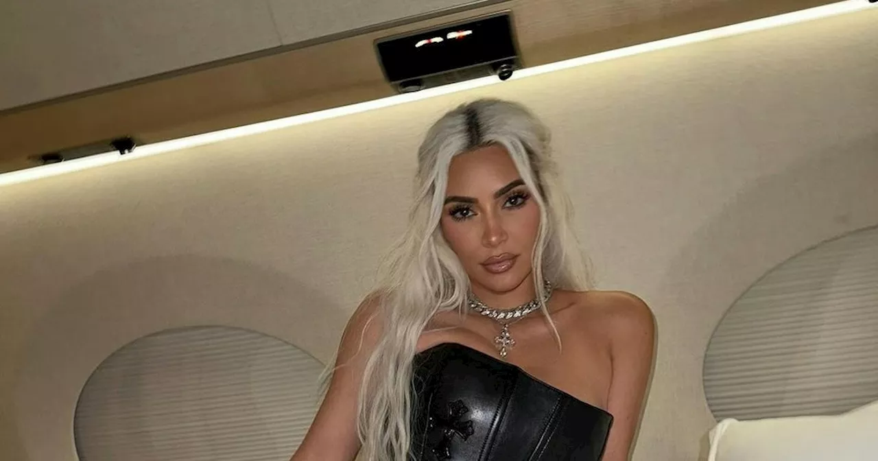 Kim Kardashian Wears A Leather Corset Gown On A Private Jet