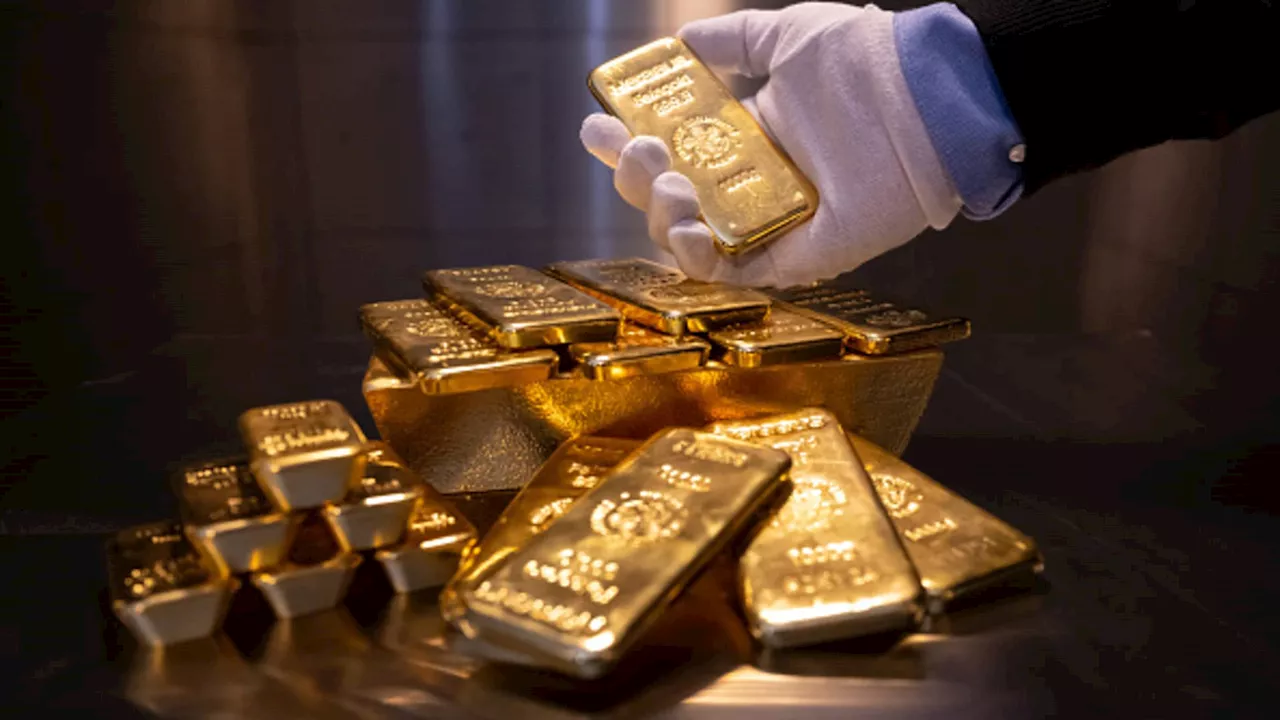 Gold little changed as dollar gains, Fed rate cut bets lend support