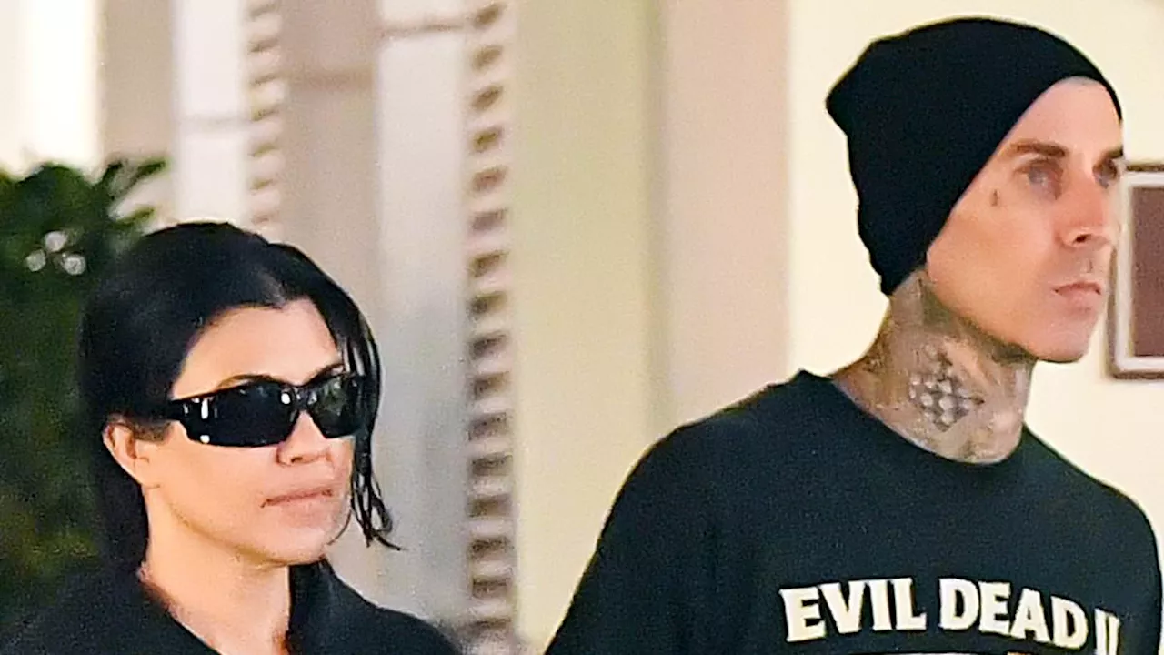 Kourtney Kardashian sweetly holds hands with husband Travis Barker on romantic stroll in...