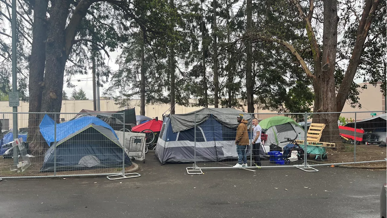 Fencing installed at Burien courthouse parking lot to manage homeless camp