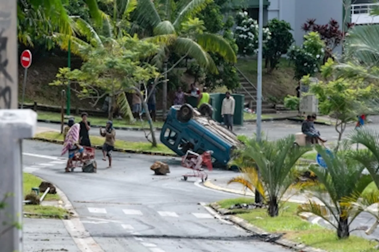 New Caledonia sees fourth night of troubles but France says Pacific territory ‘calmer’