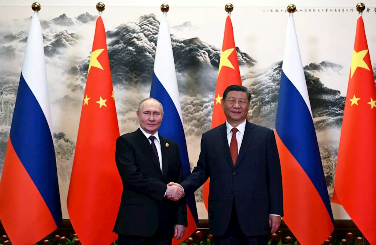 Xi lauds China-Russia ties as Putin arrives in Beijing