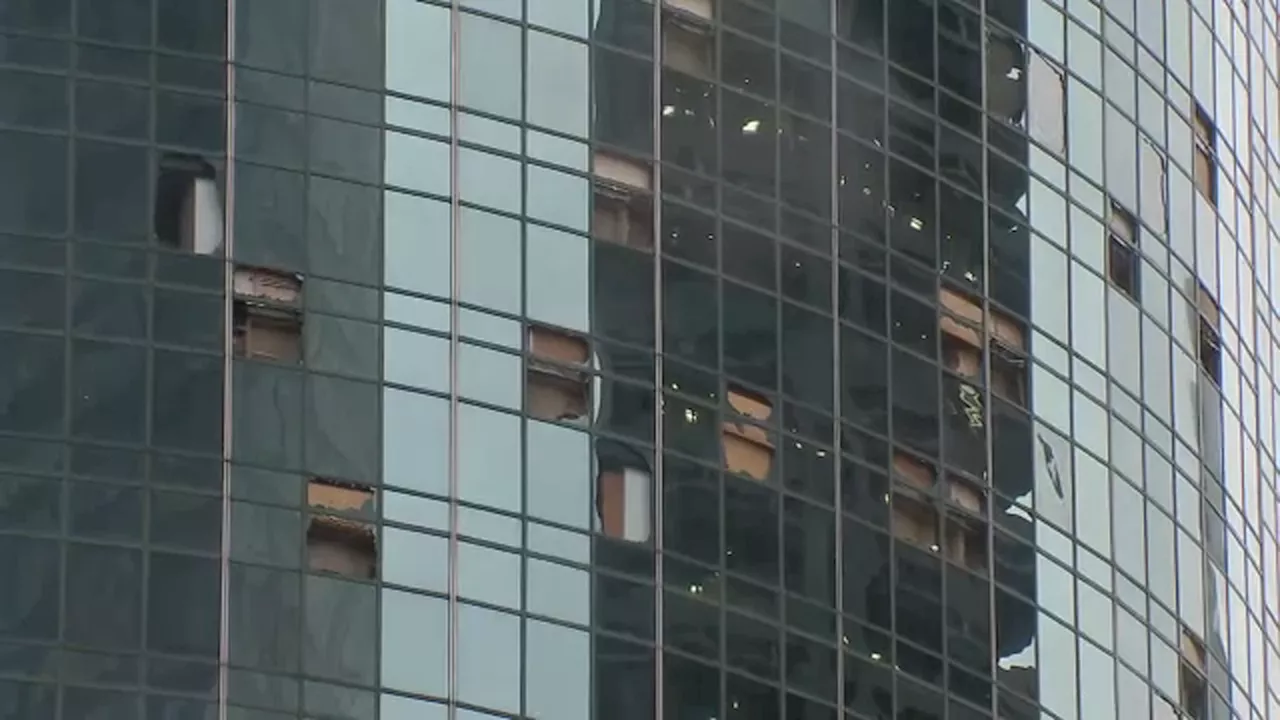 Downtown Houston riddled with glass after storm tore windows out of high-rise buildings