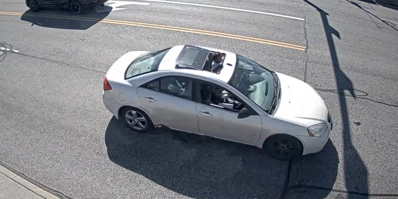 Caught on camera: Toddler spotted hanging from sunroof of moving car in Cleveland