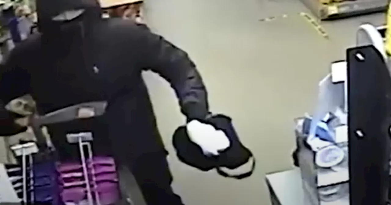 Terrified shopkeeper held at knifepoint in heart-stopping video