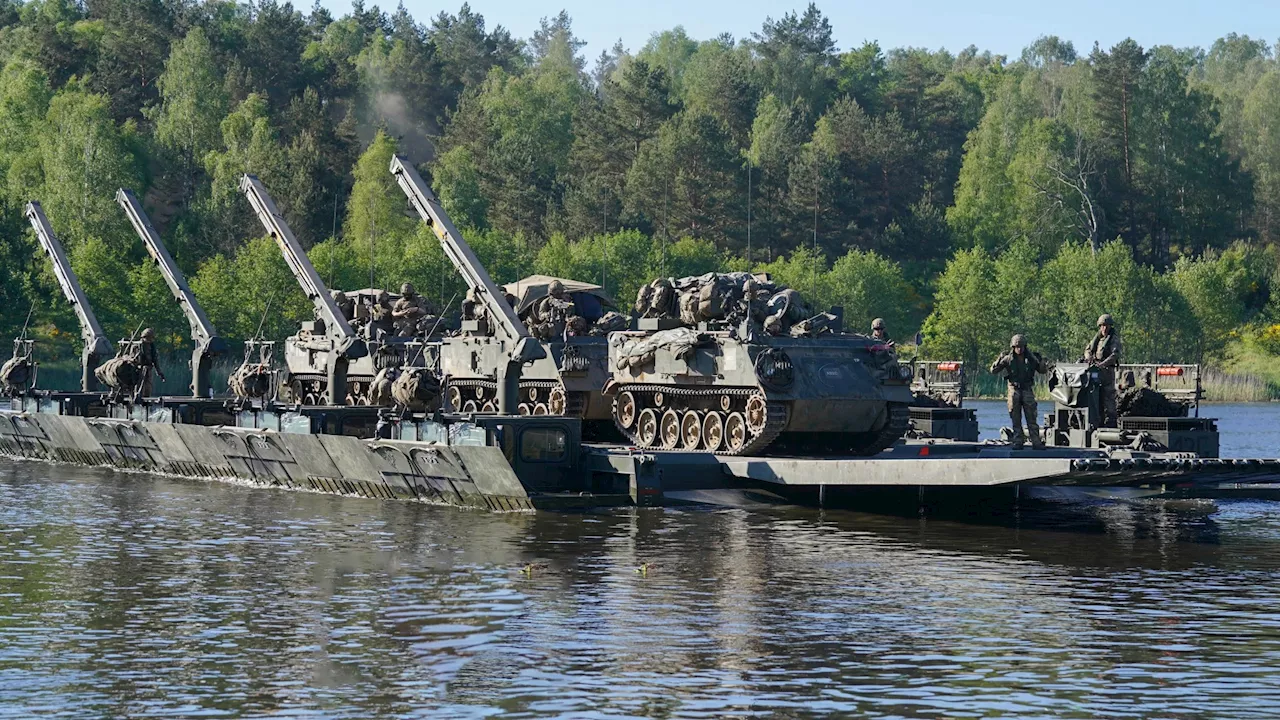 Watch crack Brit troops build river crossing in just minutes as part of largest Nato war game since end of...