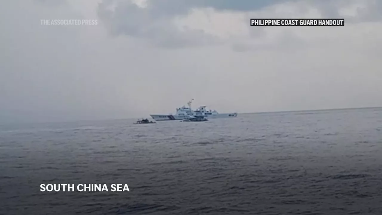 Filipino activists decide not to sail closer to disputed shoal, avoiding clash with Chinese ships