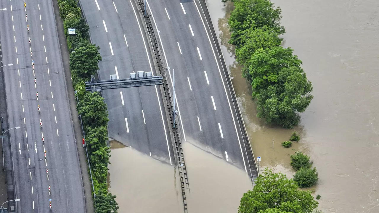 The German chancellor tours flooded regions in the southwest in a show of solidarity