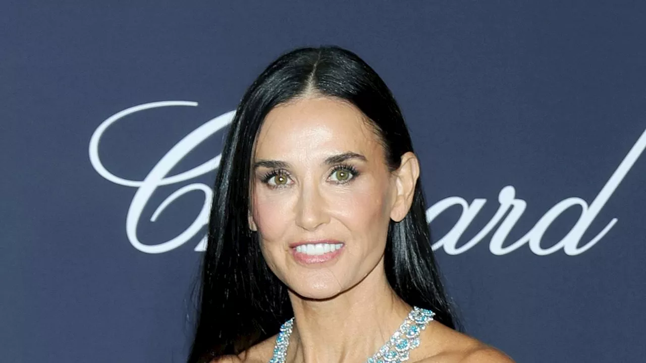 Demi Moore turns heads in blue bejeweled gown as she joins Eva Longoria and Lily Gladstone in...