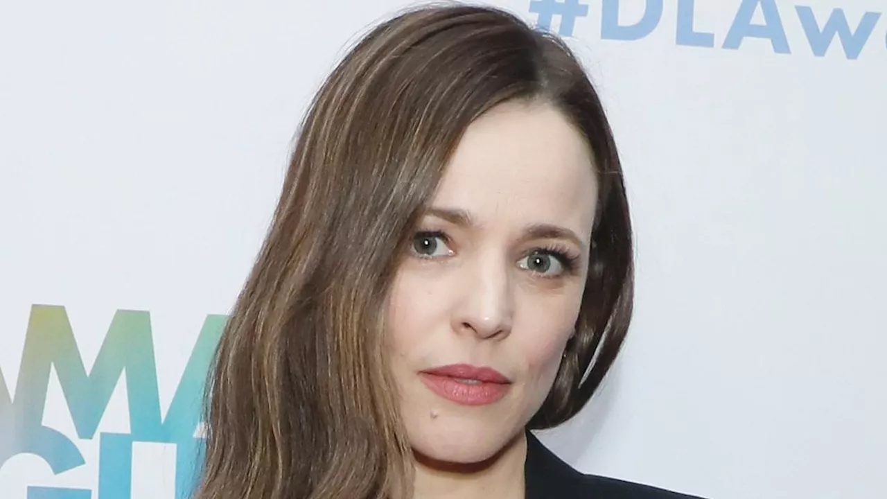 Rachel McAdams, 45, is effortlessly chic in a very plunging vest and fitted trousers as she leads...
